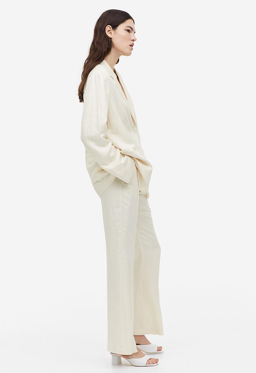 H&M - Flared viscose trousers - cream 