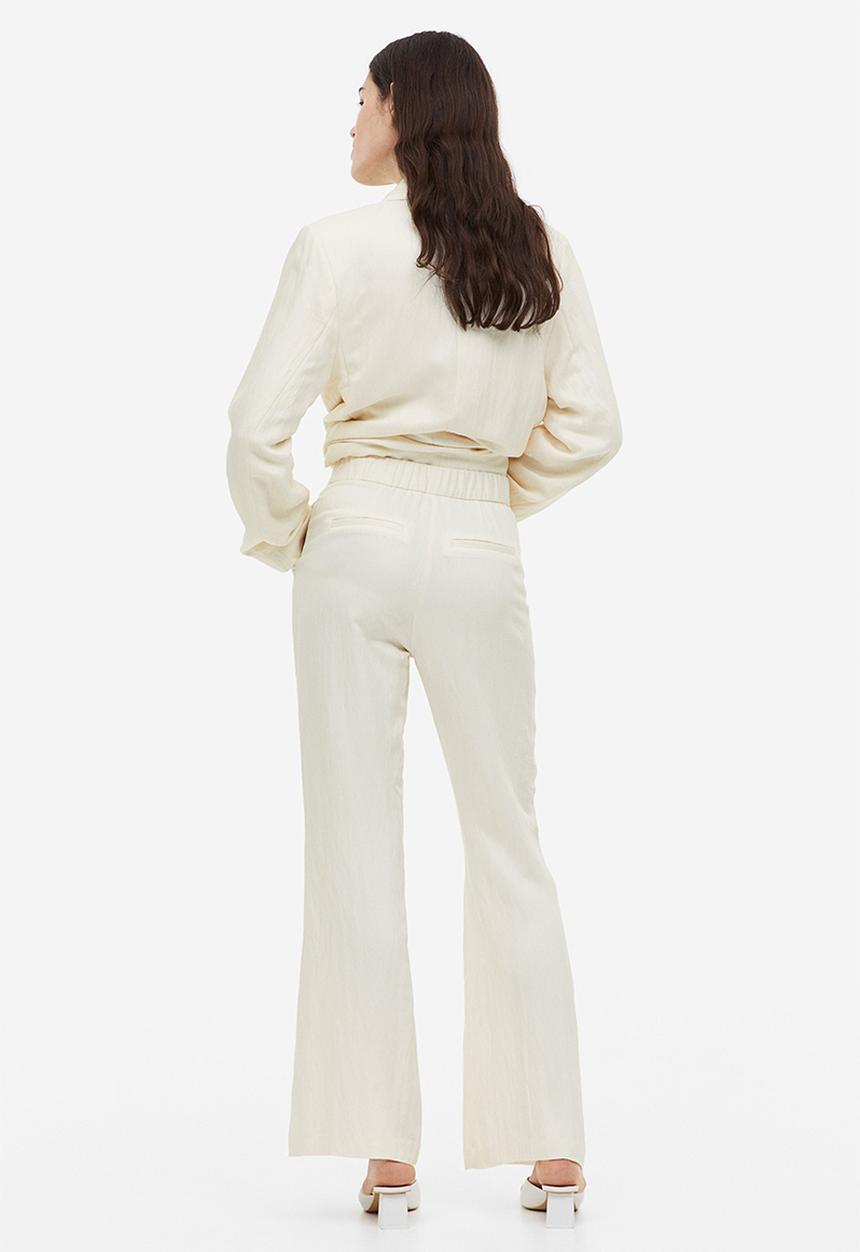 H&M - Flared viscose trousers - cream 