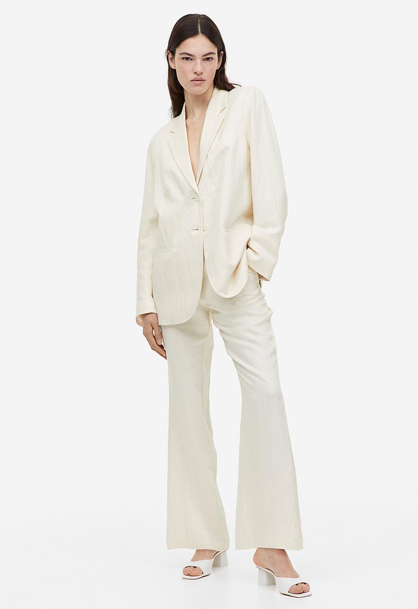 H&M - Flared viscose trousers - cream 