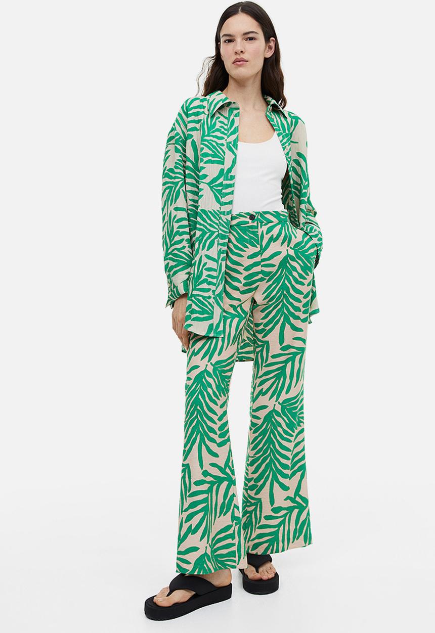 H&M - Flared trousers - light beige leaf-patterned 
