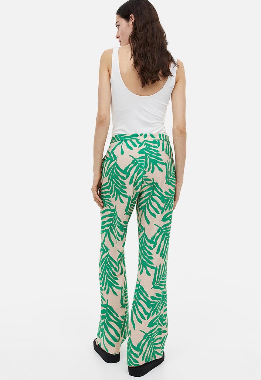 H&M - Flared trousers - light beige leaf-patterned 