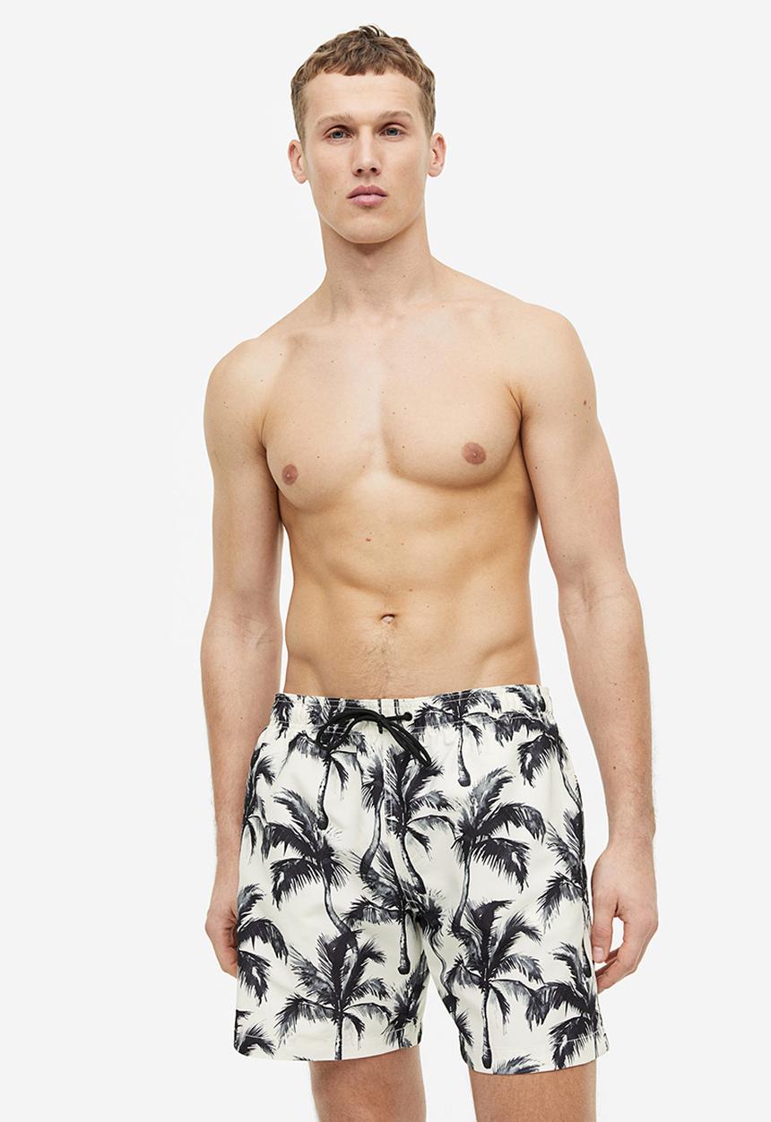 H&M - Patterned swim shorts - white palm trees