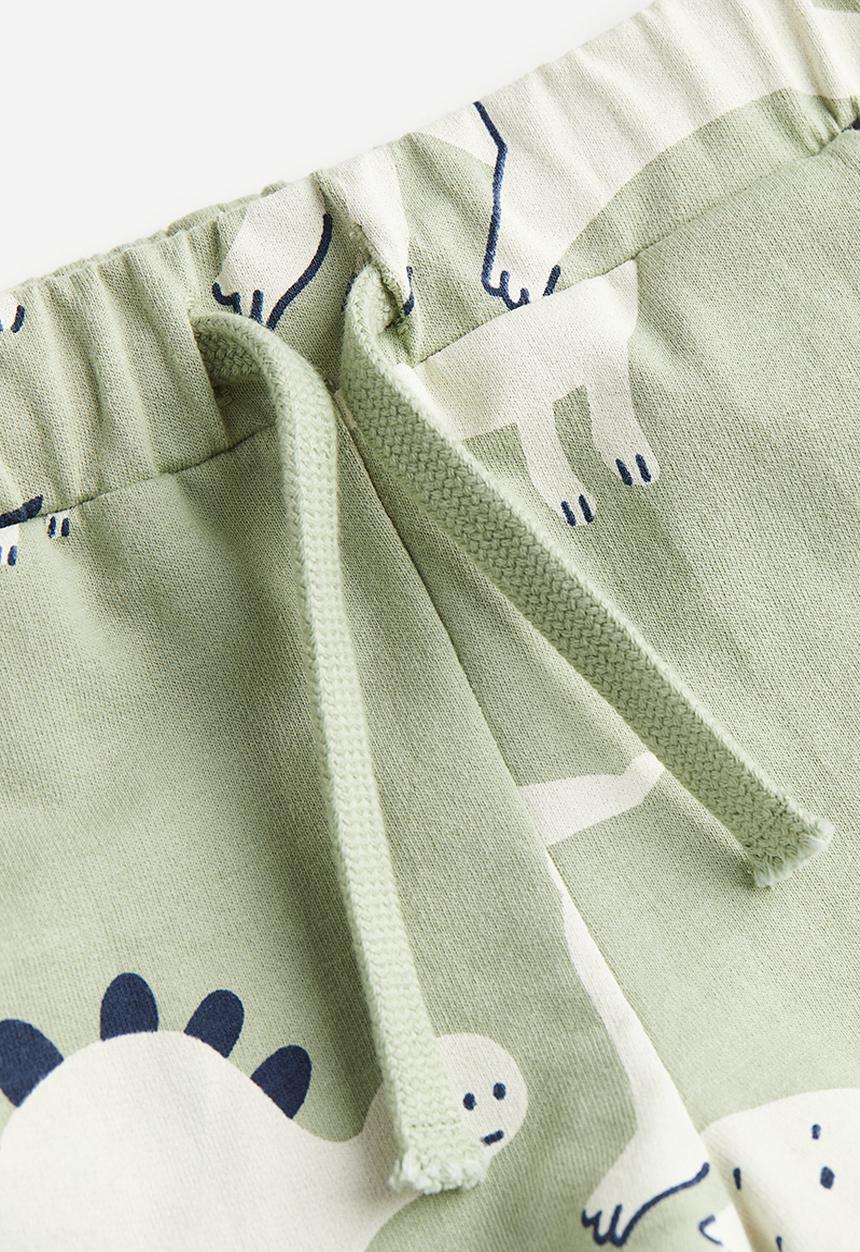 H&M - Jersey shorts - light green dinosaurs