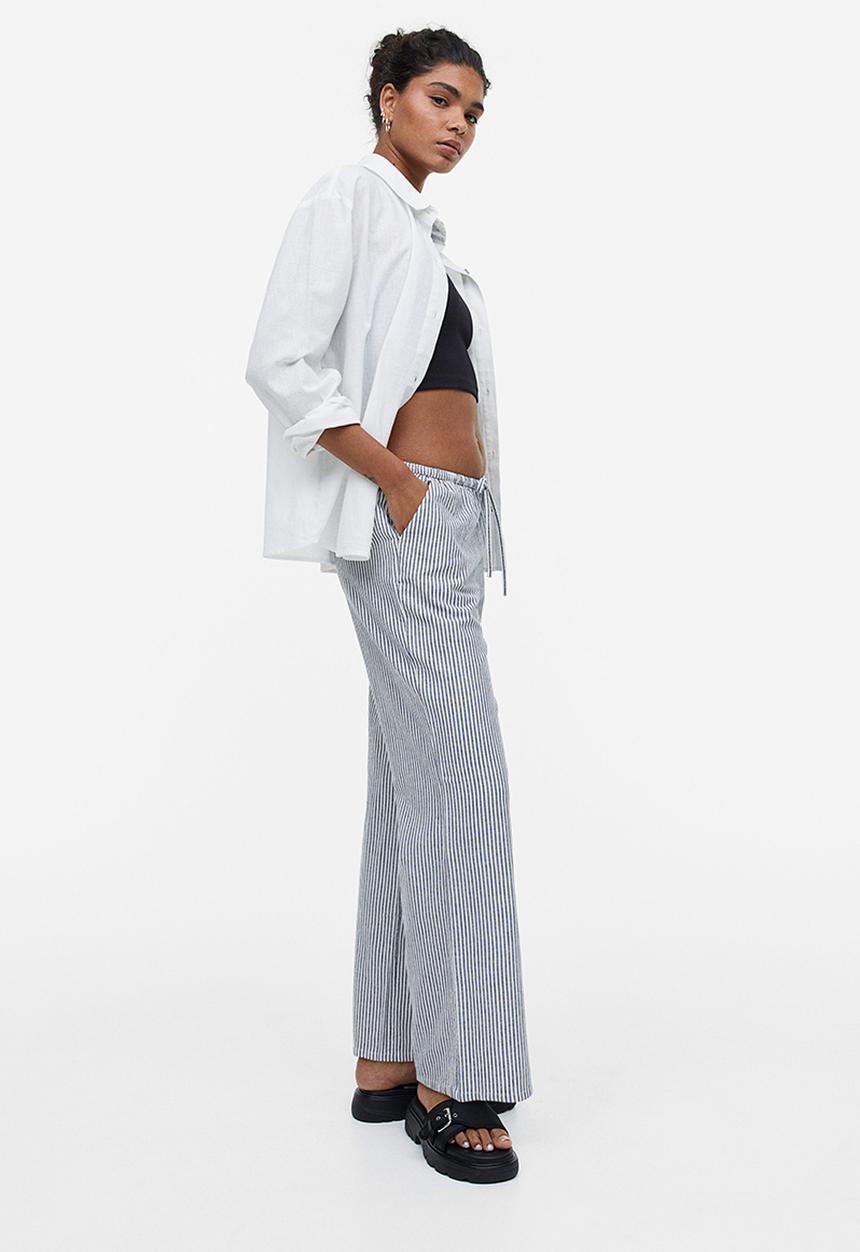 H&M - Wide trousers - dark blue striped