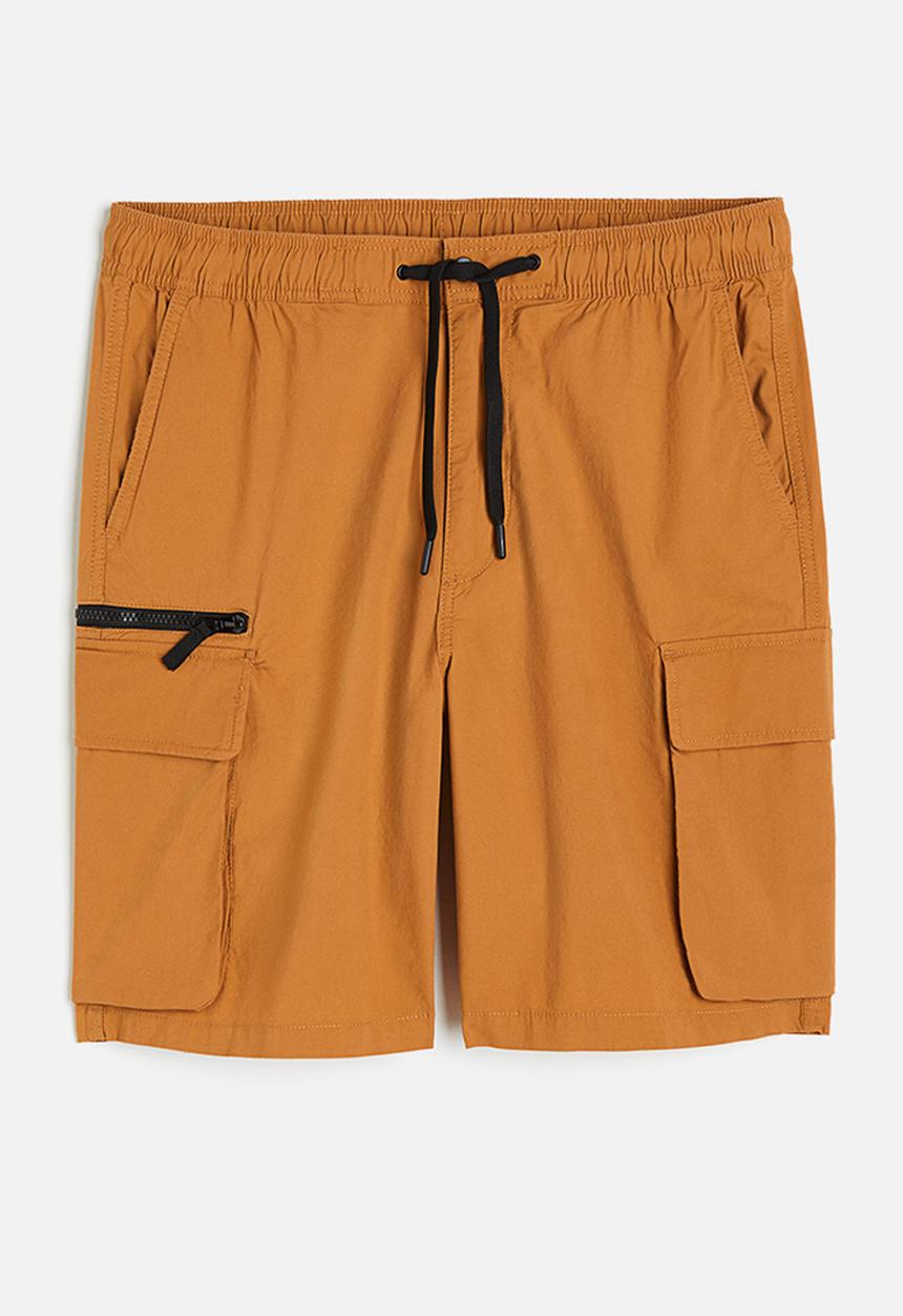 H&M - Regular fit knee-length cargo shorts - rust orange 