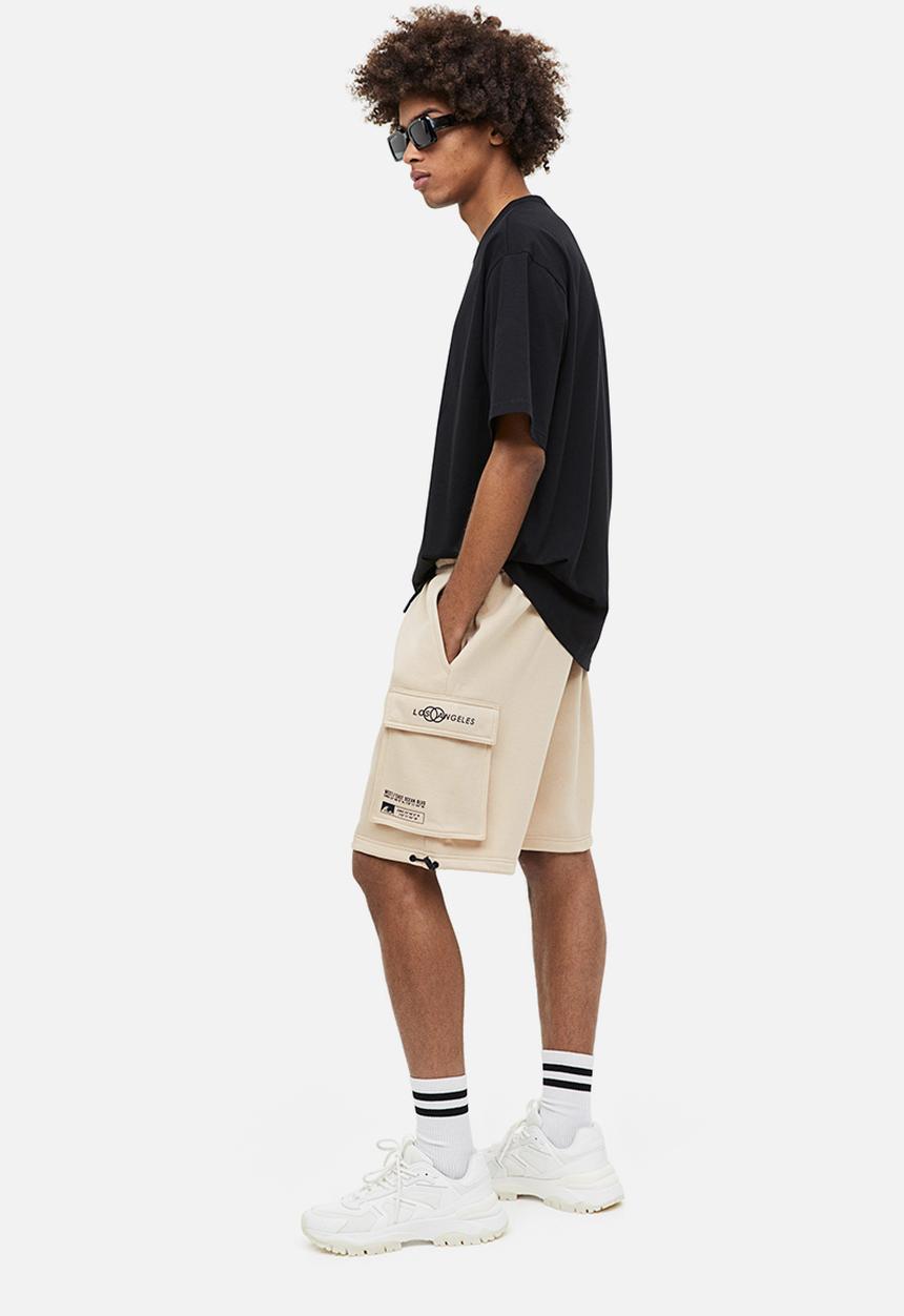 H&M - Relaxed fit printed cargo sweat shorts - beige los angeles