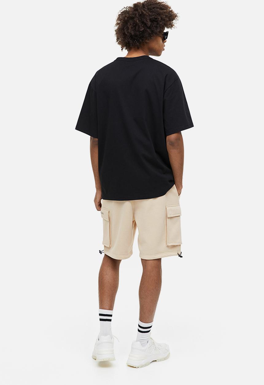 H&M - Relaxed fit printed cargo sweat shorts - beige los angeles