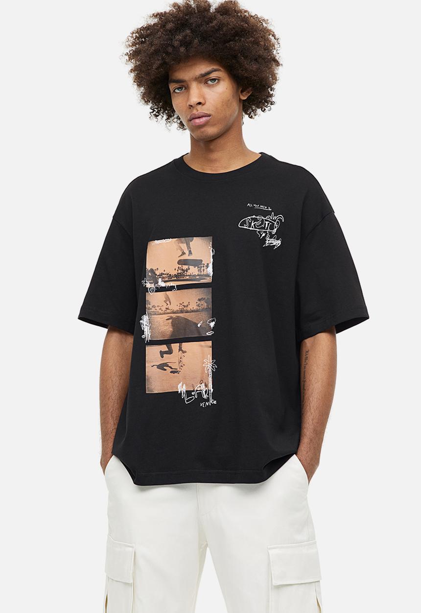 H&M - Relaxed fit printed T-shirt - black happens in la