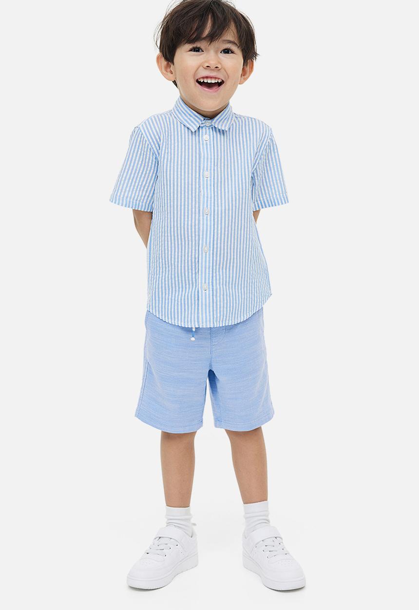 H&M - Loose fit chino shorts - light blue