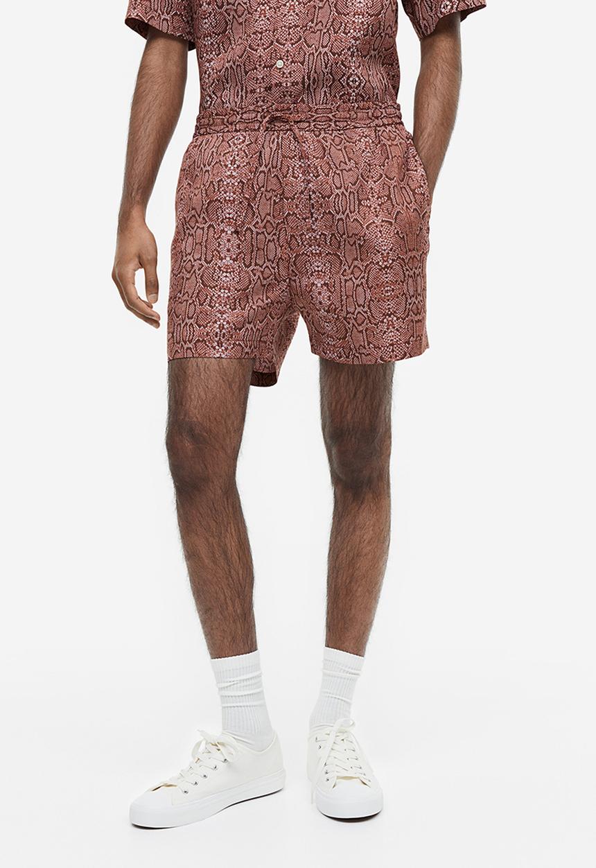 H&M - Regular fit lyocell shorts - dark red snakeskin patterned