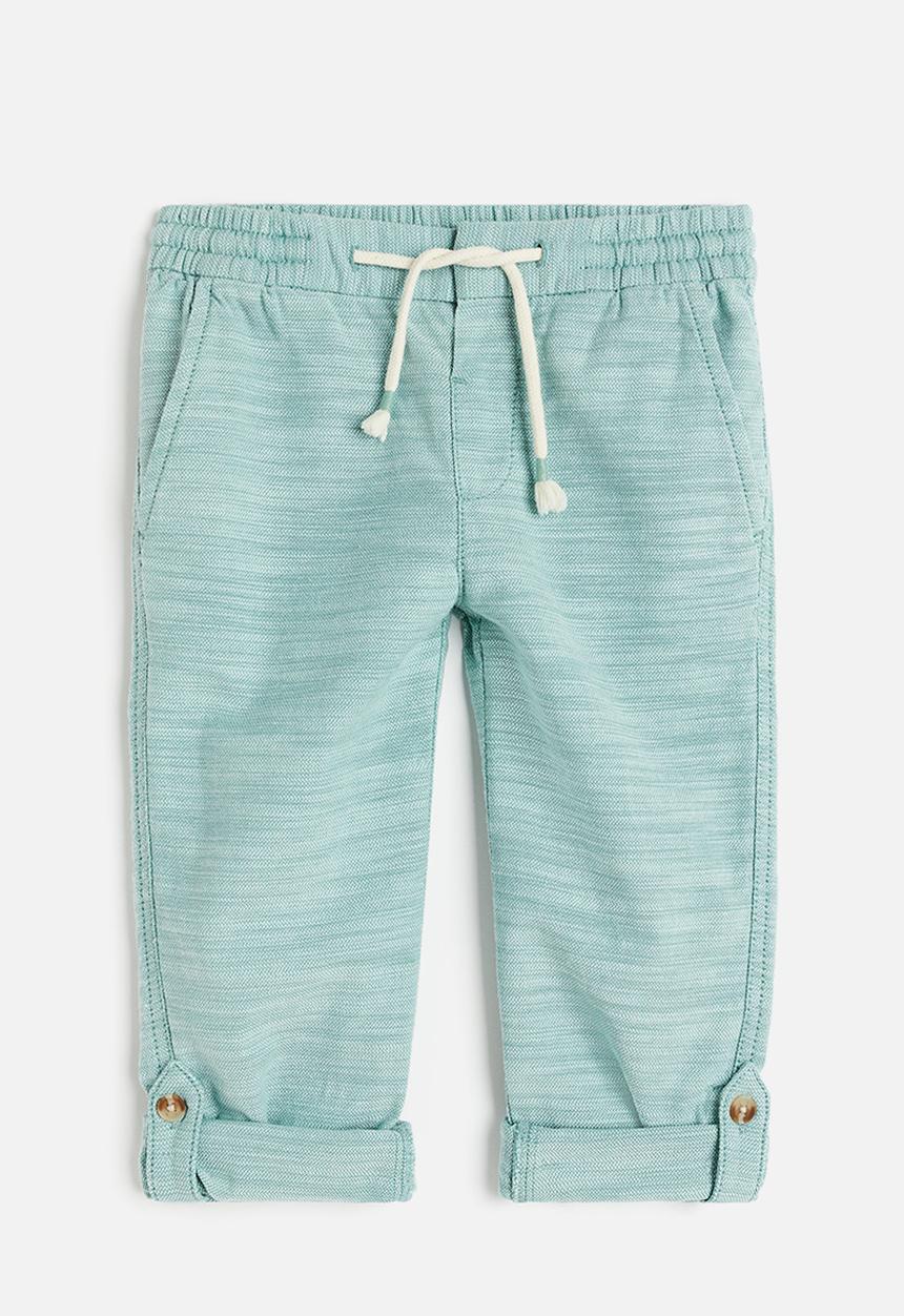 H&M - Loose fit roll-up trousers - light turquoise
