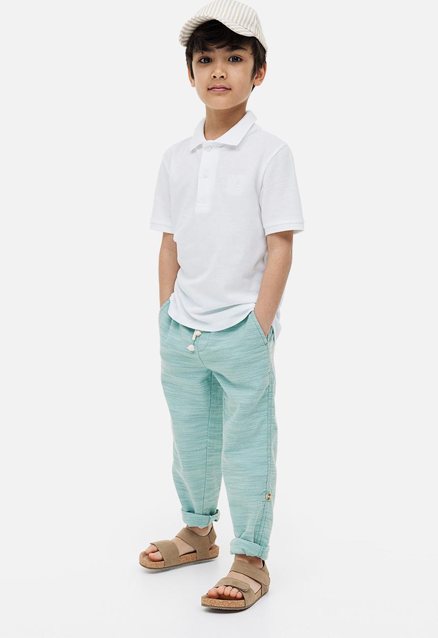 H&M - Loose fit roll-up trousers - light turquoise