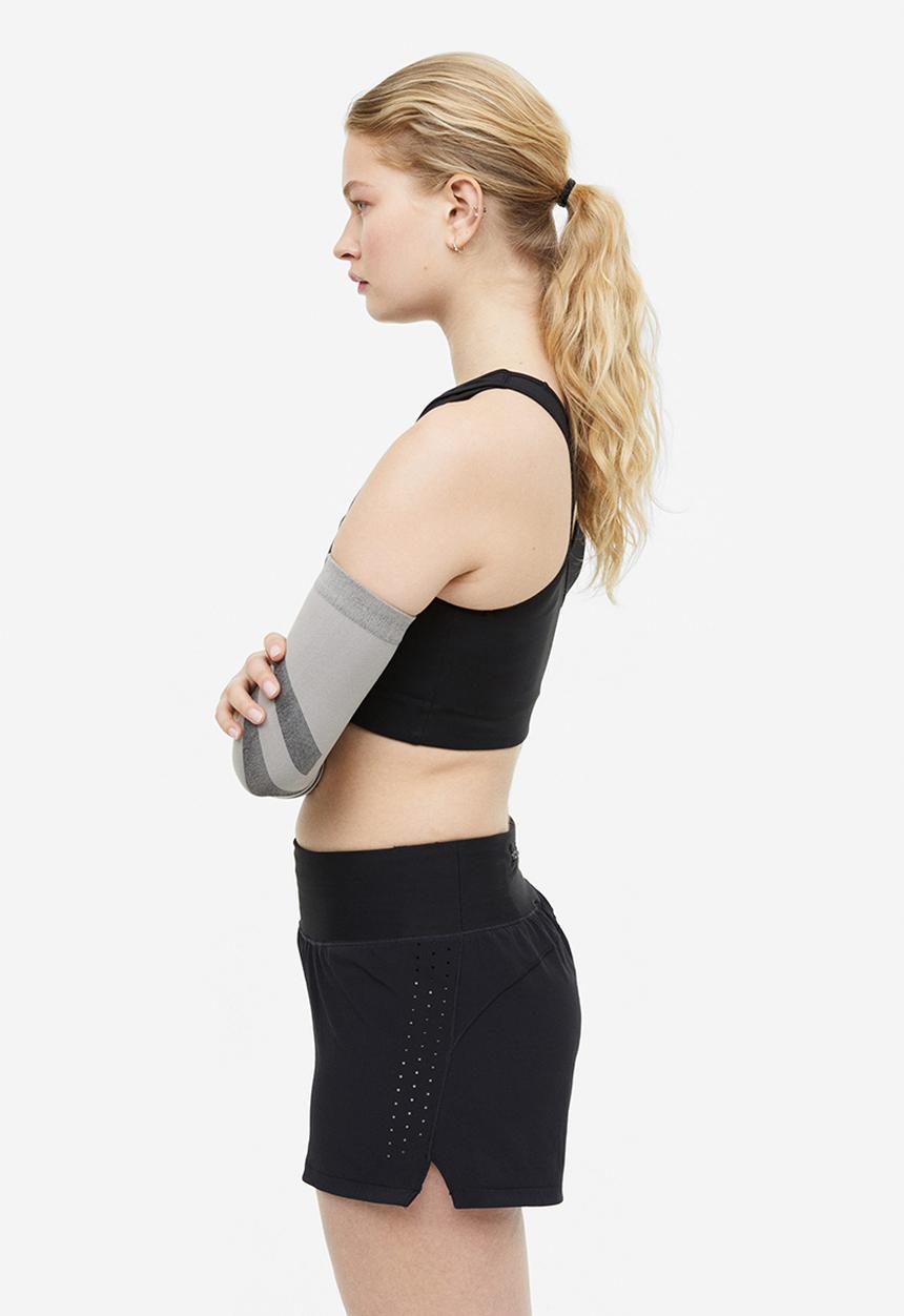 H&M - Drymove™ double-layered sports shorts - black