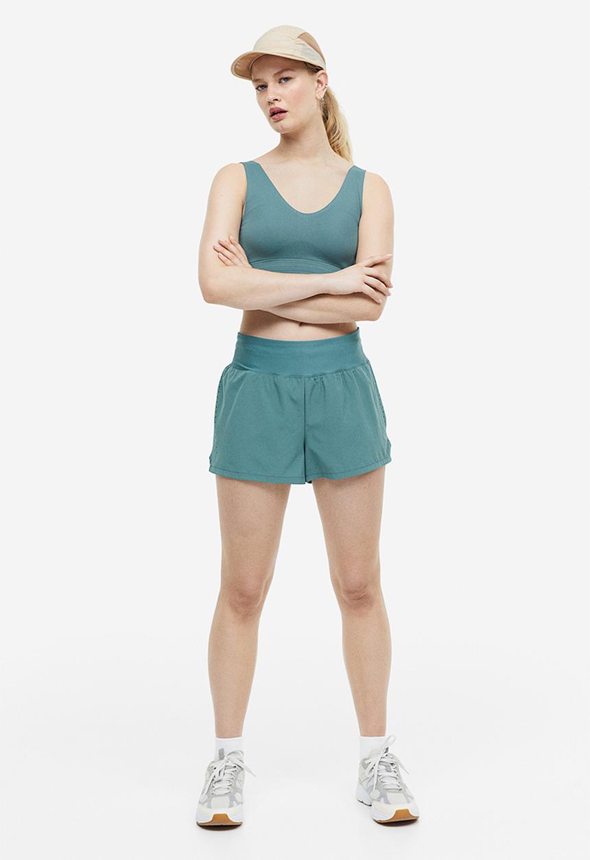 H&M - Drymove™ double-layered sports shorts - teal