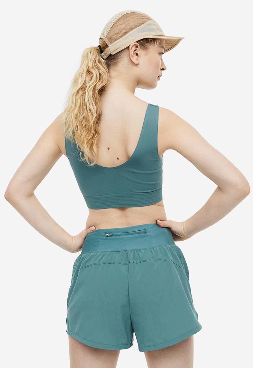 H&M - Drymove™ double-layered sports shorts - teal