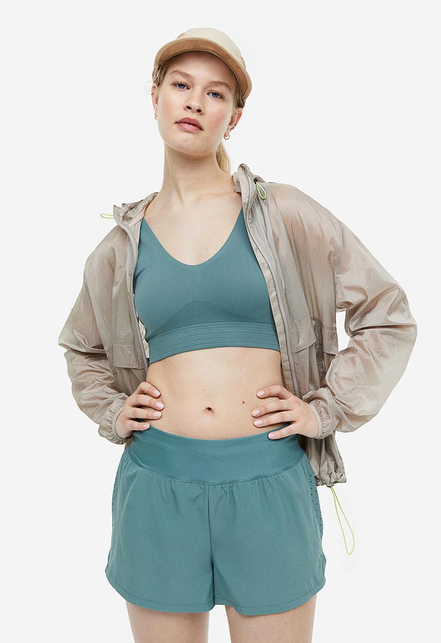 H&M - Drymove™ double-layered sports shorts - teal