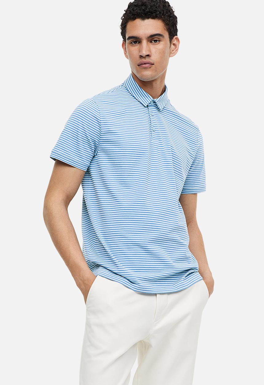H&M - Slim fit polo shirt - blue/light blue striped