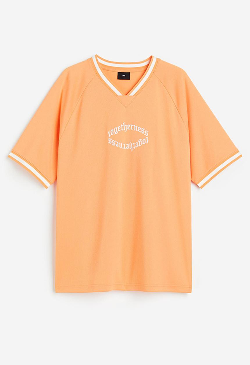 H&M - Oversized fit printed mesh t-shirt - pale orange togetherness