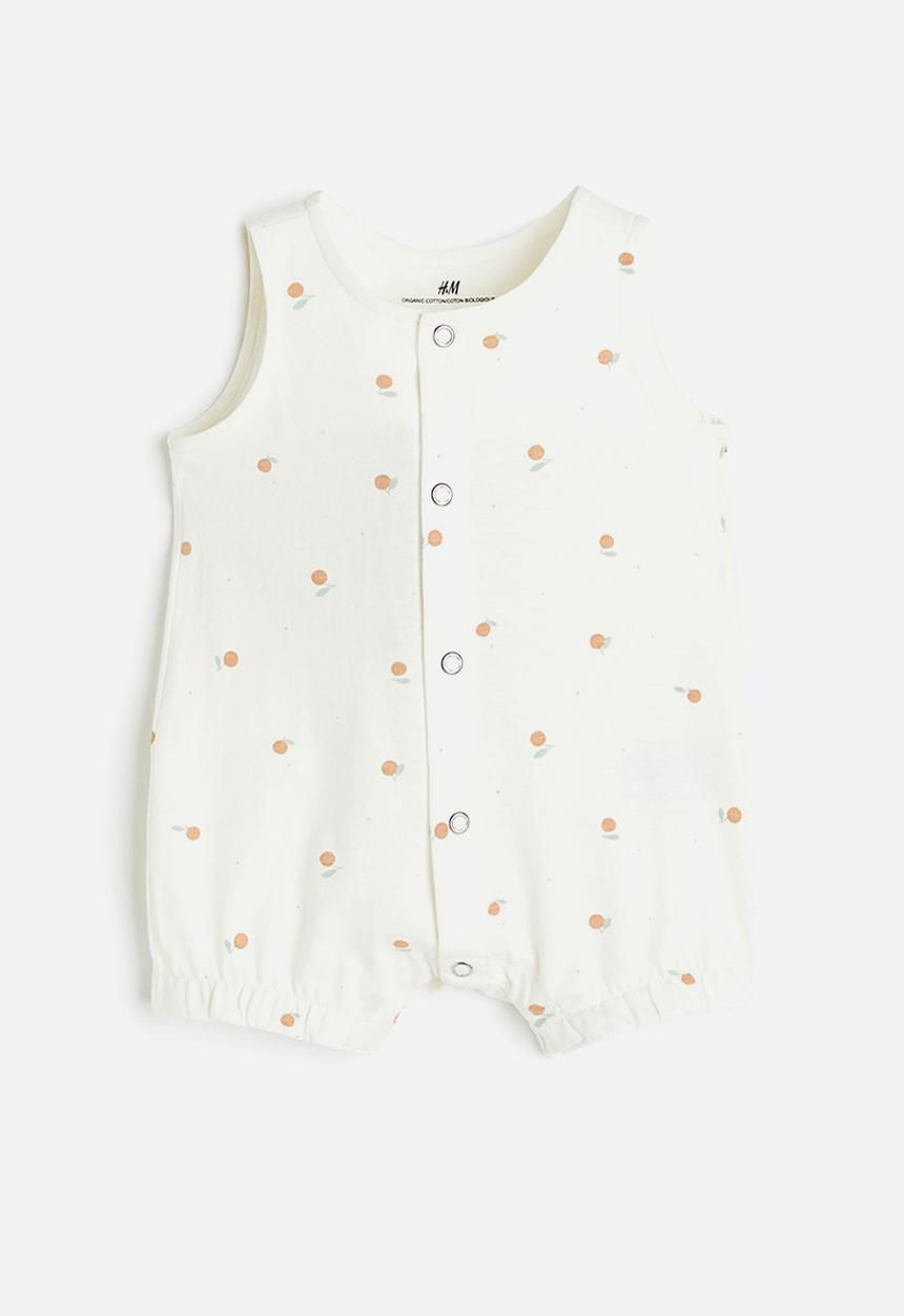 H&M - Patterned romper suit - cream/peaches