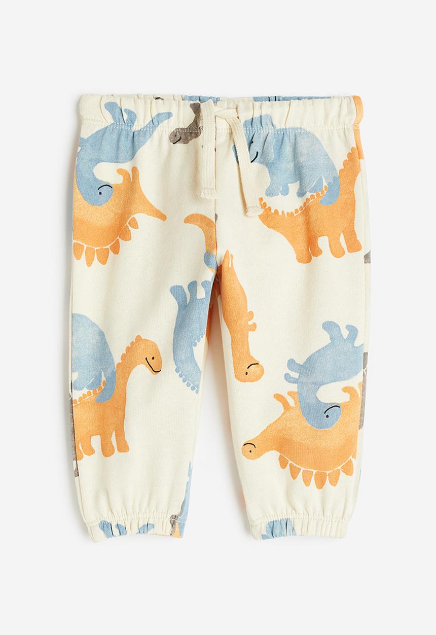 H&M - Cotton joggers - light beige dinosaurs