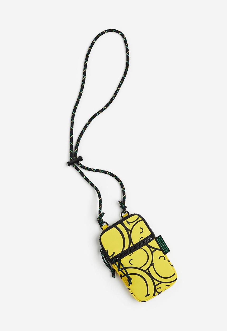 H&M - Patterned smartphone bag - bright yellow smileyworld®