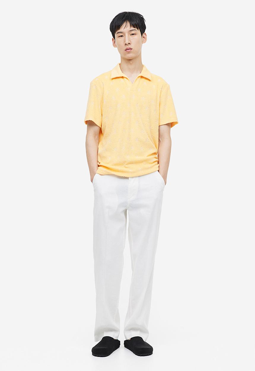 H&M - Regular fit terry polo shirt - yellow/palm trees