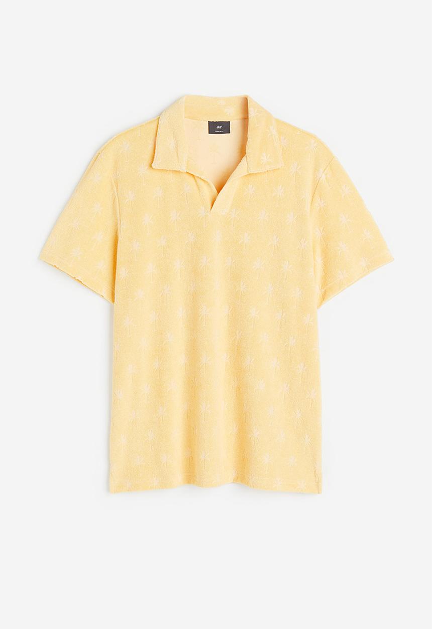 H&M - Regular fit terry polo shirt - yellow/palm trees