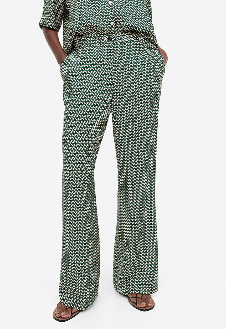 H&M - Flared trousers - dark green & patterned