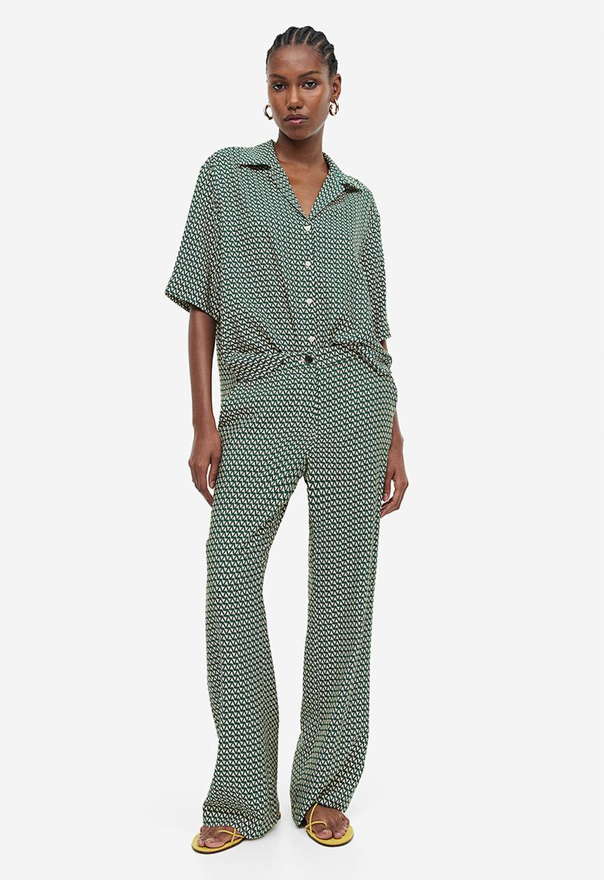 H&M - Flared trousers - dark green & patterned