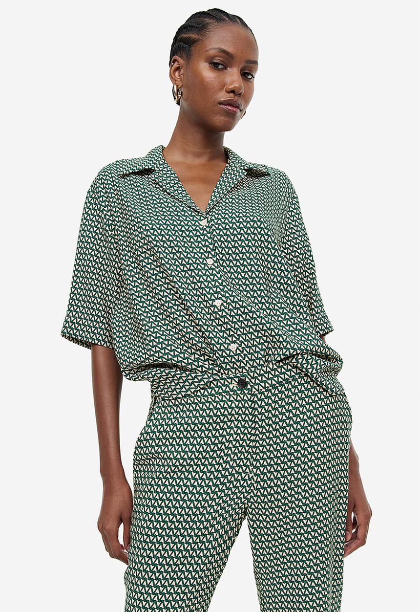 H&M - Flared trousers - dark green & patterned