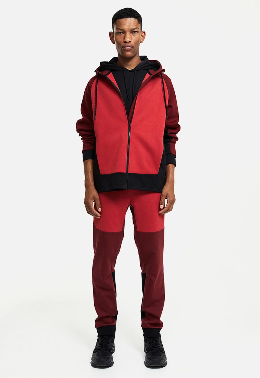 H&M - Drymove™ tapered tech joggers with zipped pockets - red