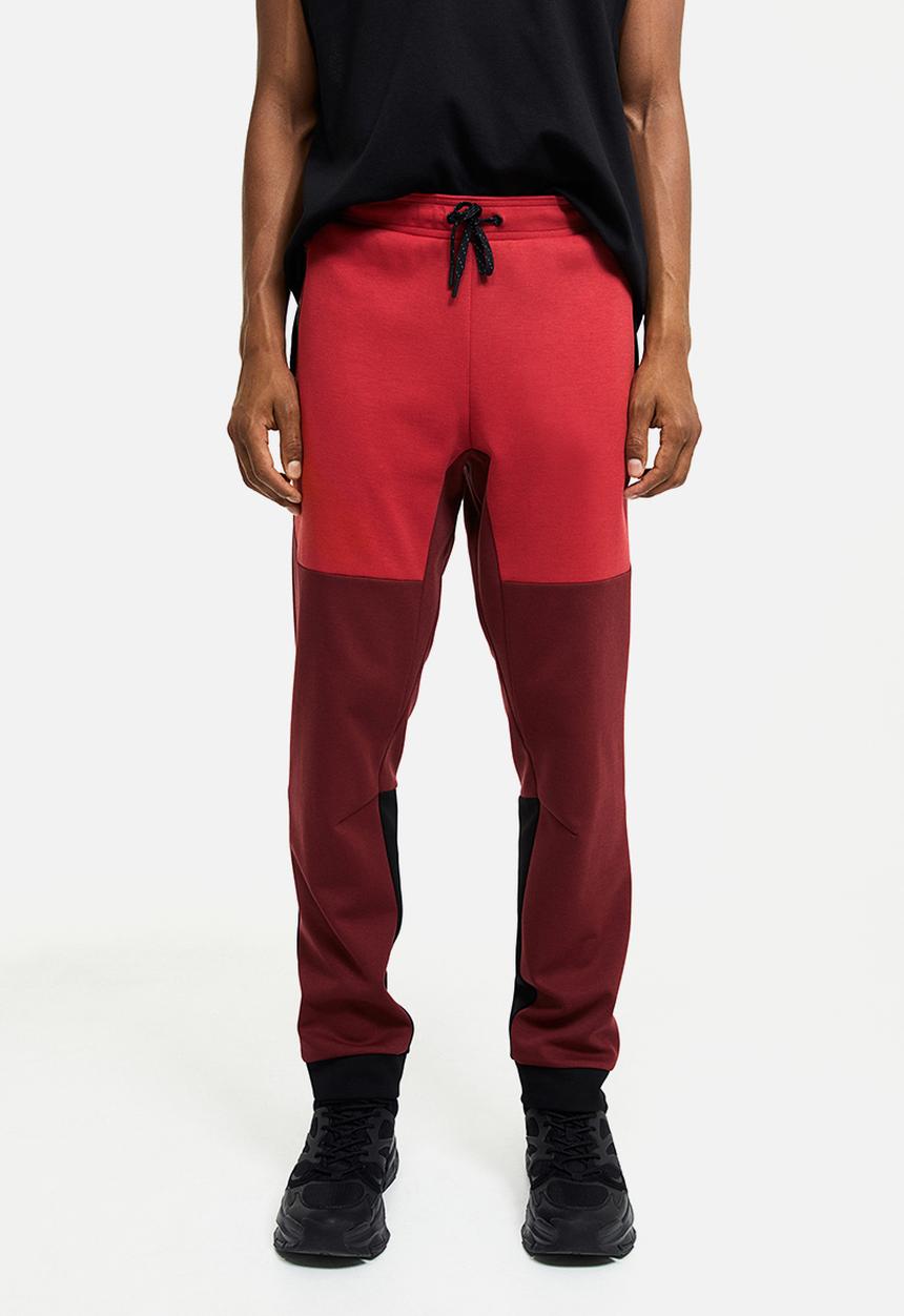 H&M - Drymove™ tapered tech joggers with zipped pockets - red
