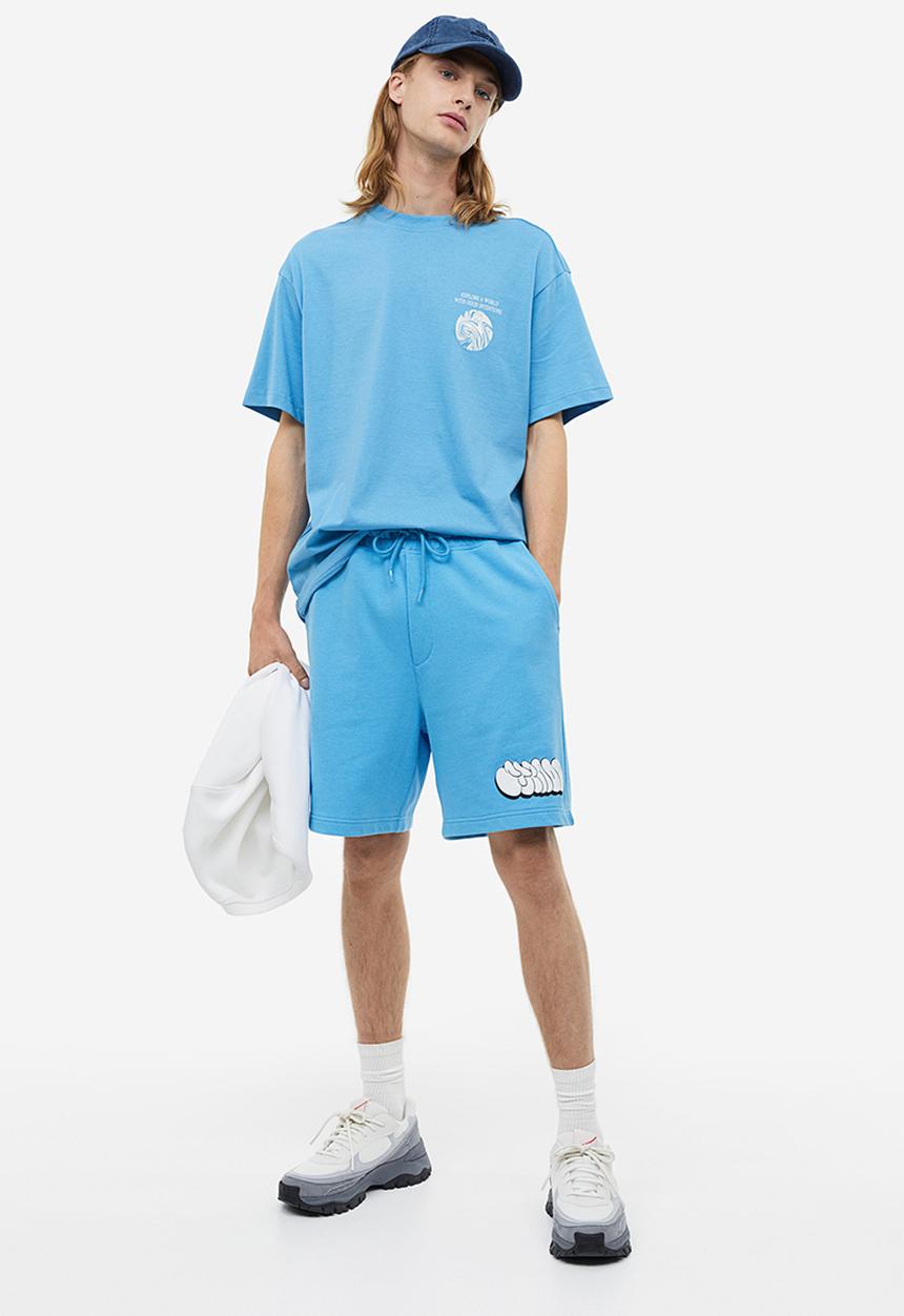 H&M - Relaxed fit printed sweatshorts - light blue/strada