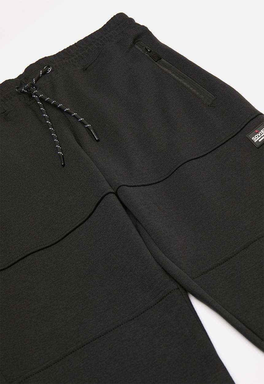 SOVIET - Track pants - black