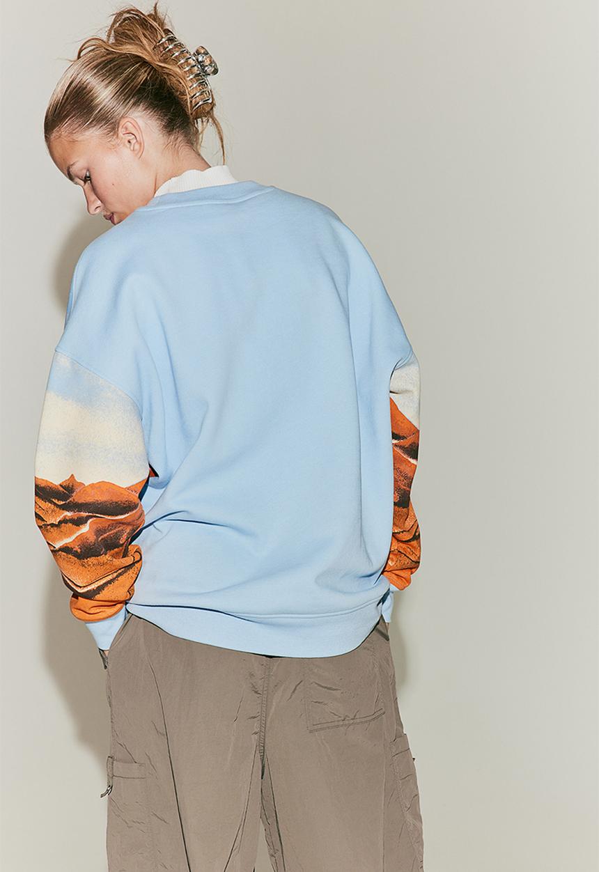H&M - Oversized printed sweatshirt - light blue/arizona