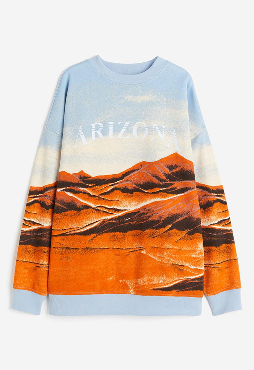 H&M - Oversized printed sweatshirt - light blue/arizona