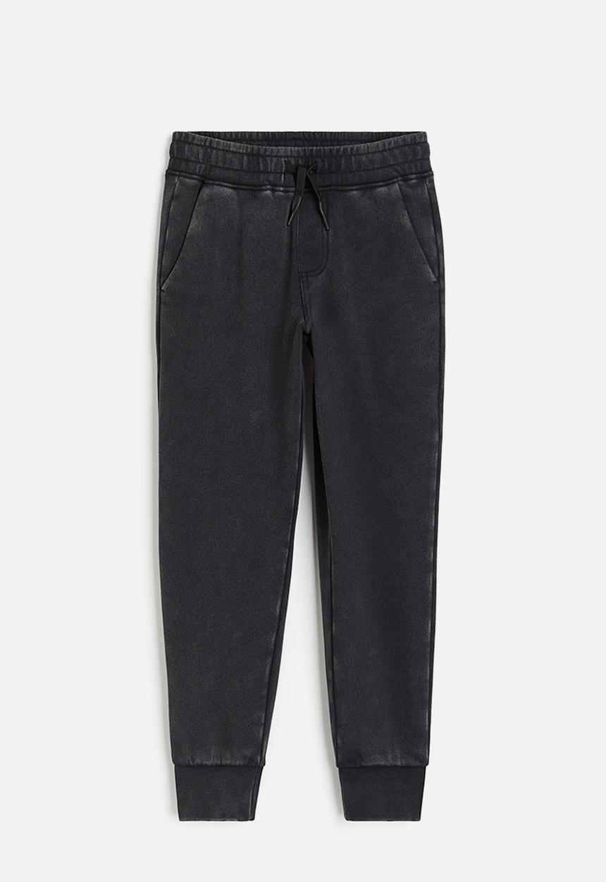 H&M - Printed joggers - black/washed out