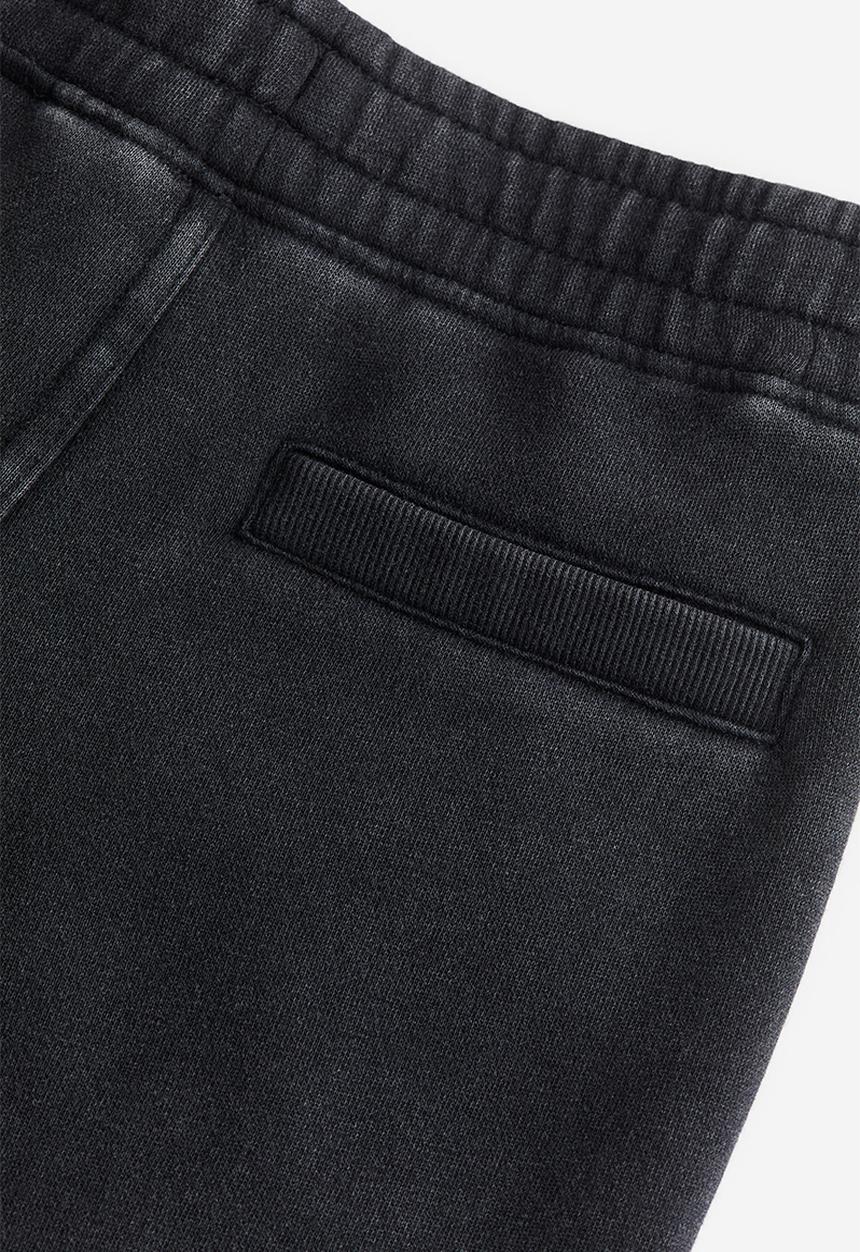 H&M - Printed joggers - black/washed out