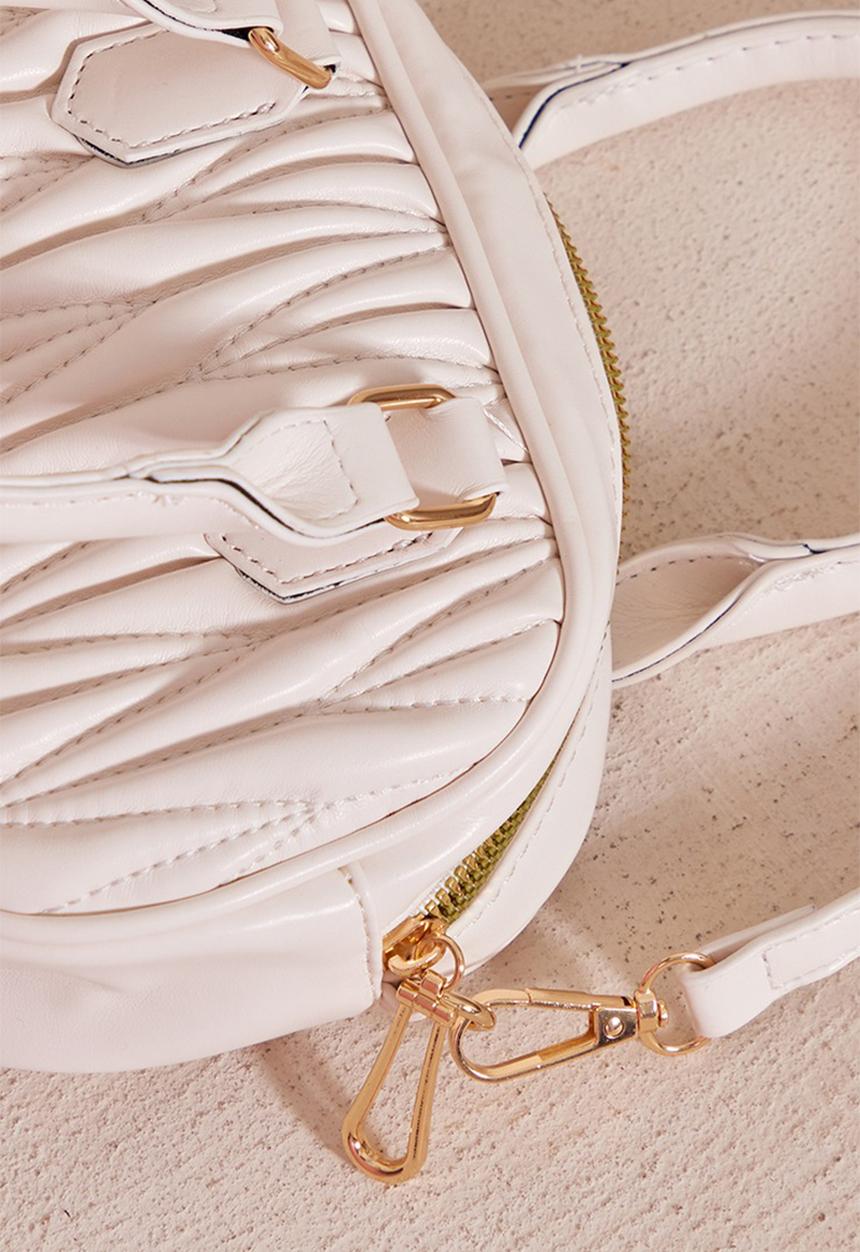 PrettyLittleThing - Cream quilted rounded cross body bag - cream