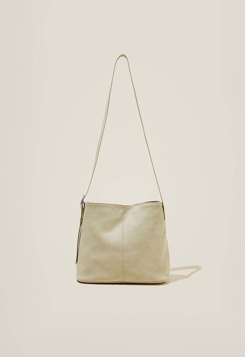 Rubi - Bentley bucket cross body bag- light stone faux suede