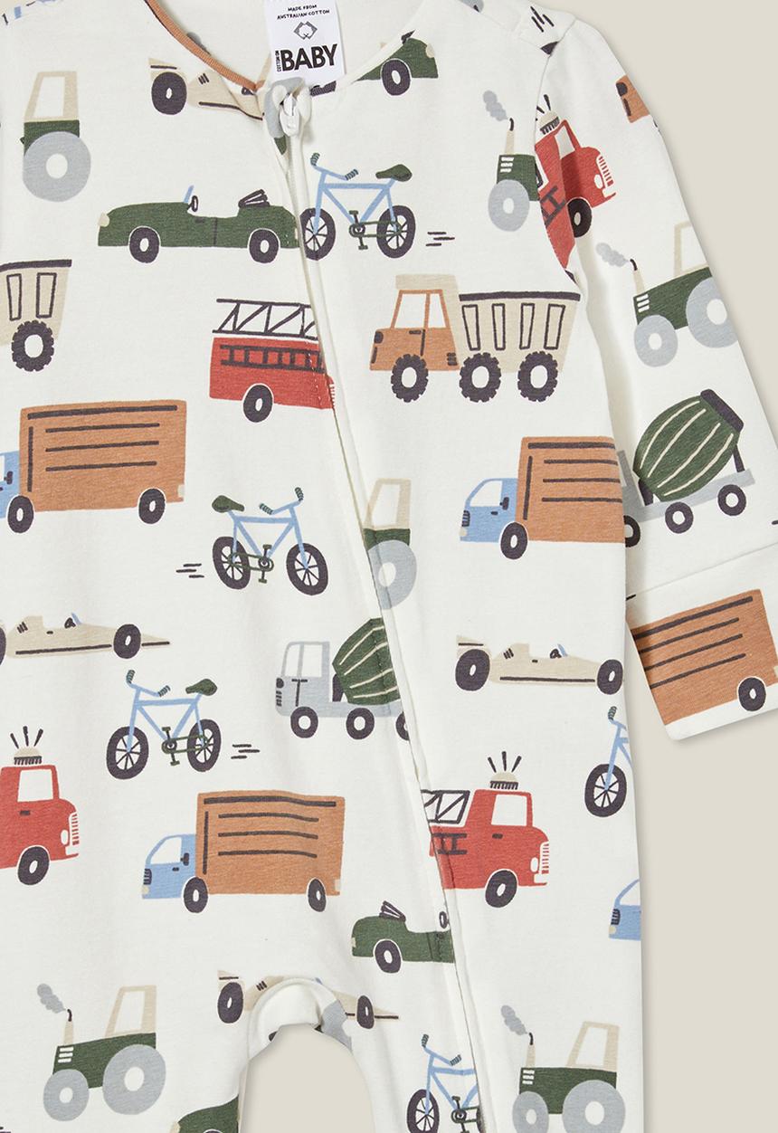 Cotton On - The long sleeve zip romper - vanilla/vintage construction trucks