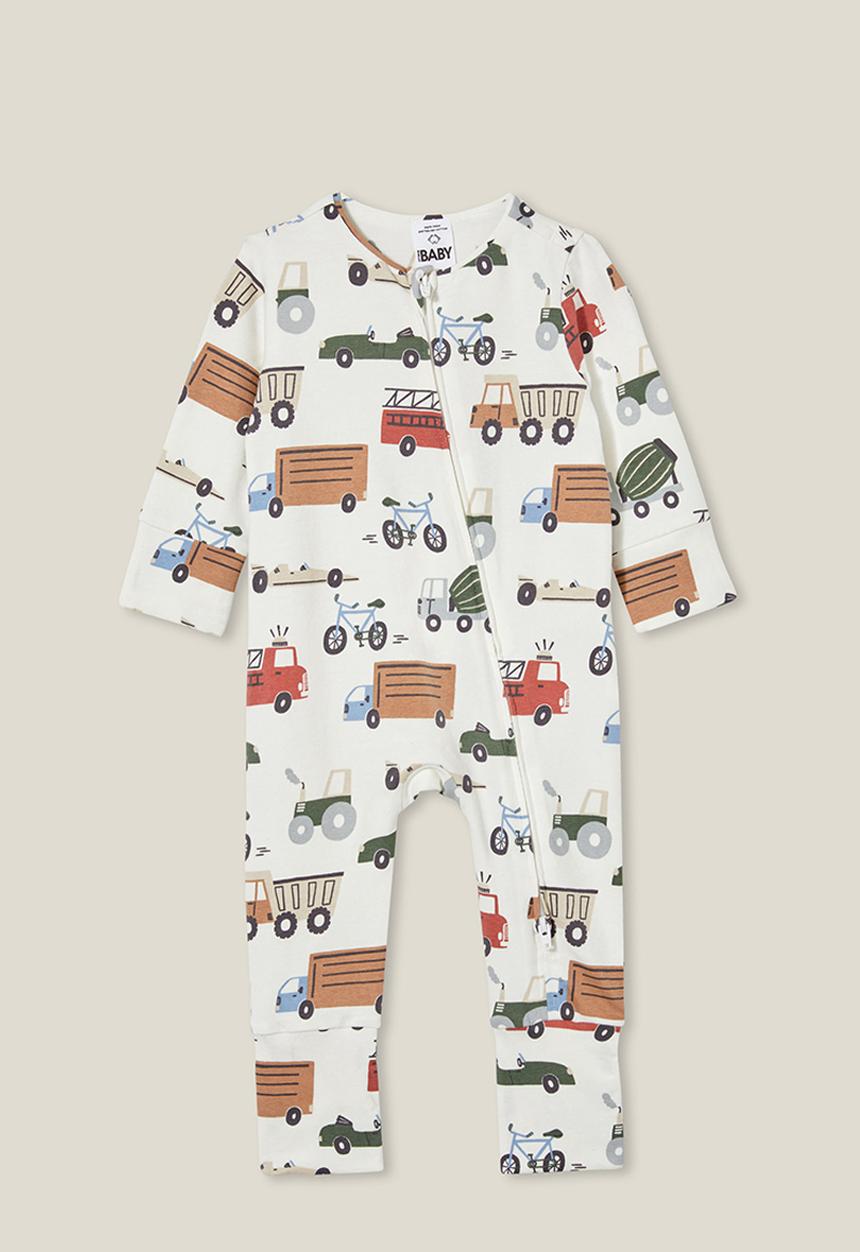 Cotton On - The long sleeve zip romper - vanilla/vintage construction trucks