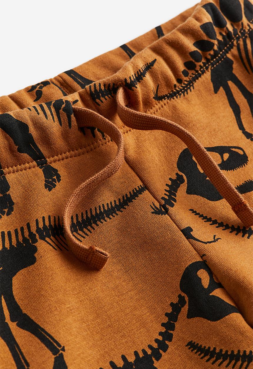 H&M - Printed joggers - brown dinosaurs