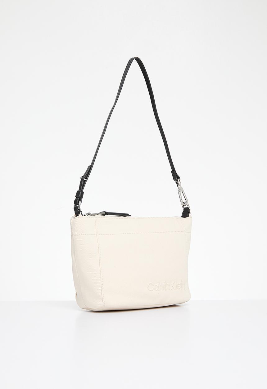 Calvin Klein - Summer story convertible pouch- dk ecru