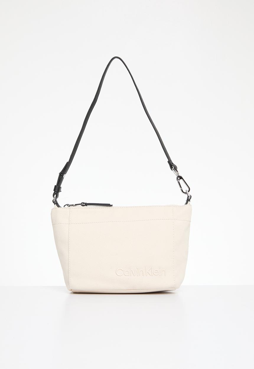 Calvin Klein - Summer story convertible pouch- dk ecru