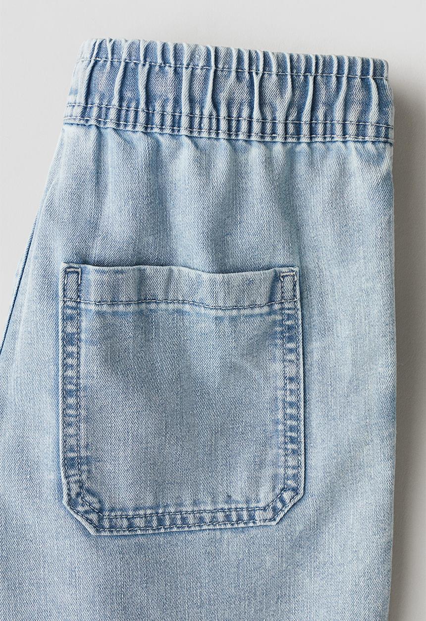 H&M - Keith Haring X H&M:  Loose fit denim shorts - light denim blue