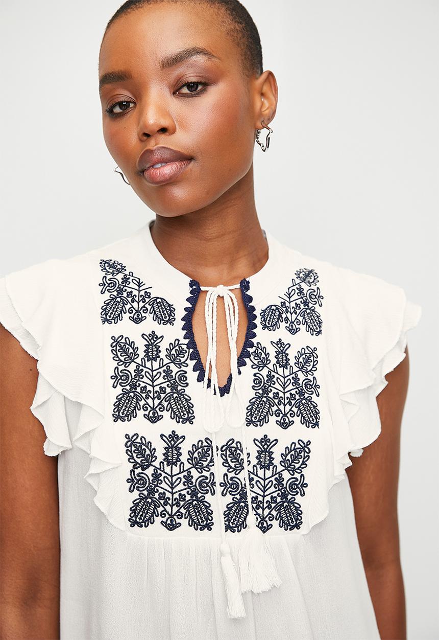 Notch neck ruffle top with embroidery detail - white/navy