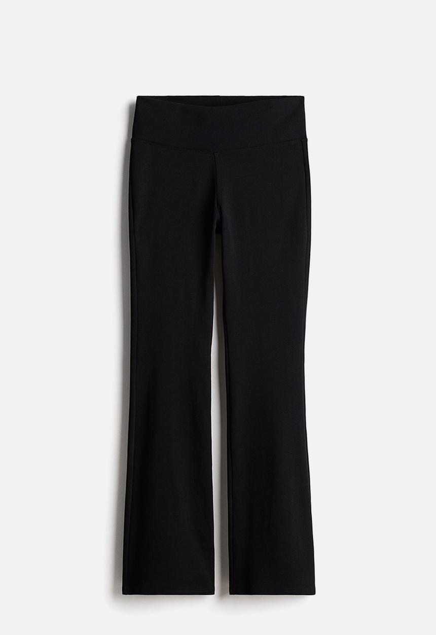 H&M - Flared leggings - black/ribbed