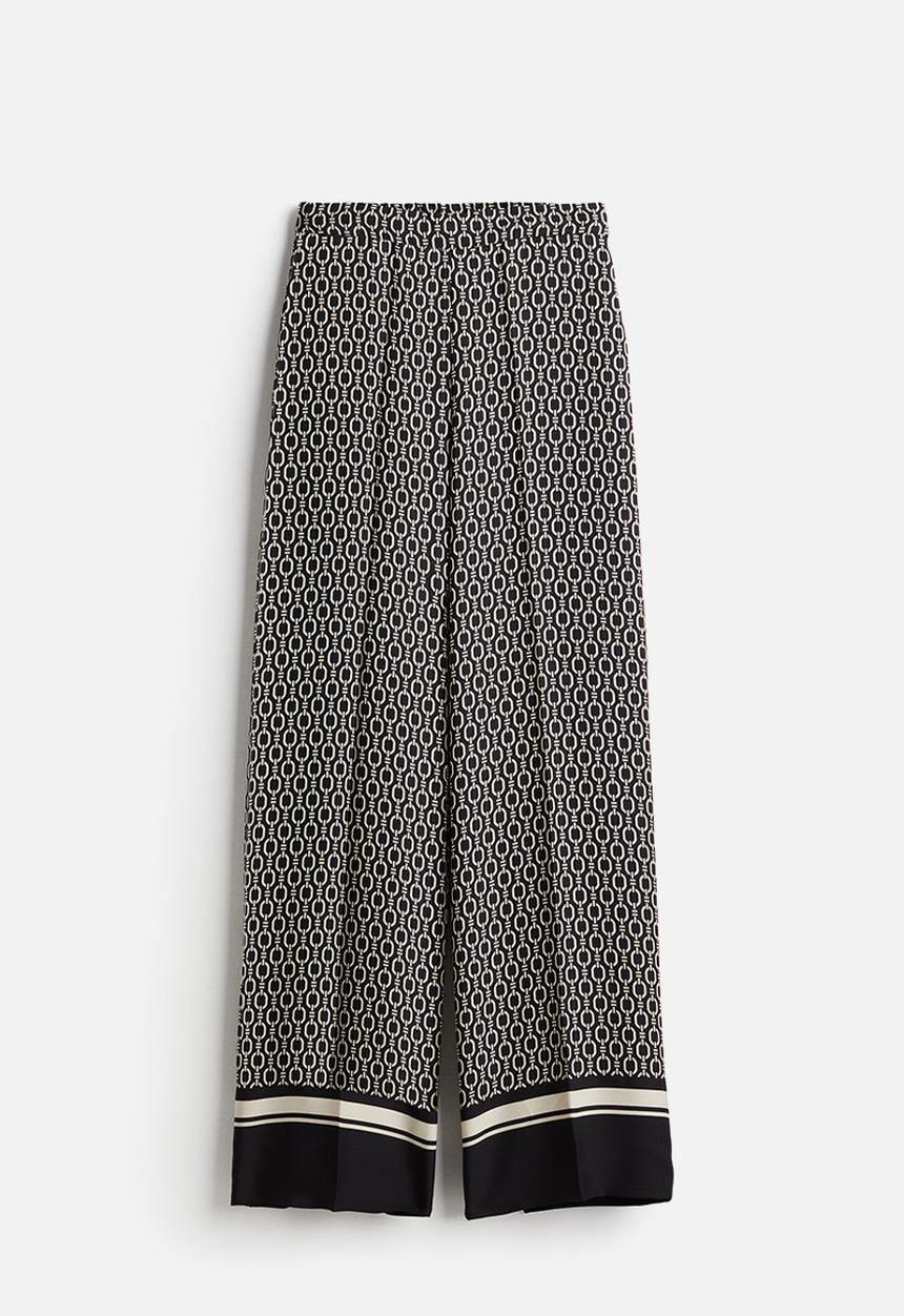 H&M - Wide trousers - black & patterned