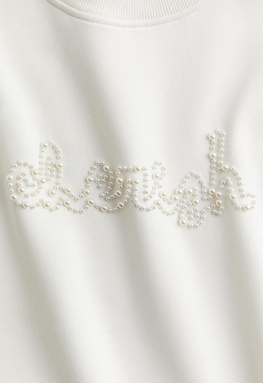 H&M - Oversized embellished sweatshirt - cream cherish